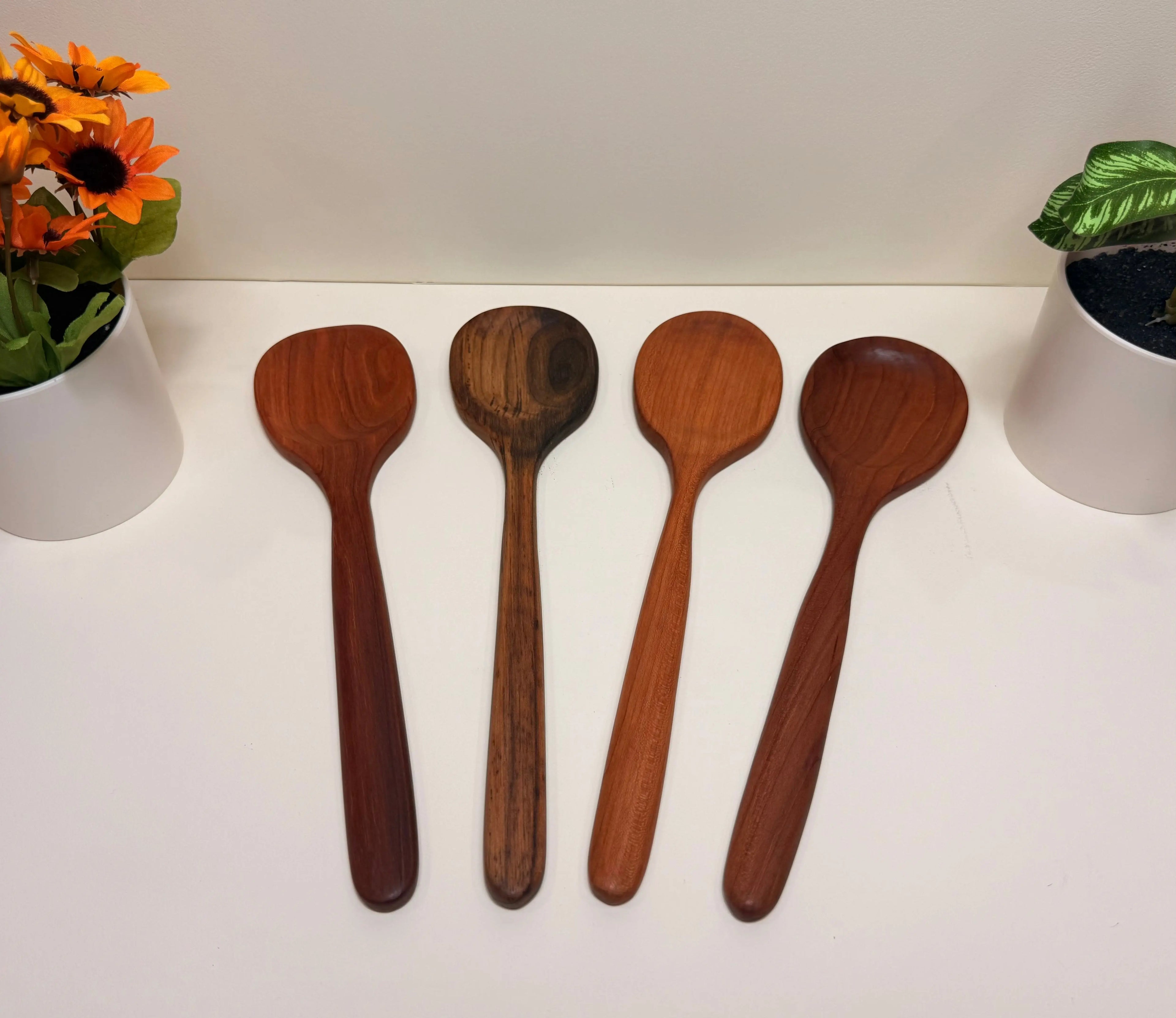 Handcrafted wooden kitchen utensil set, four rounded-head spoons in walnut and cherry wood