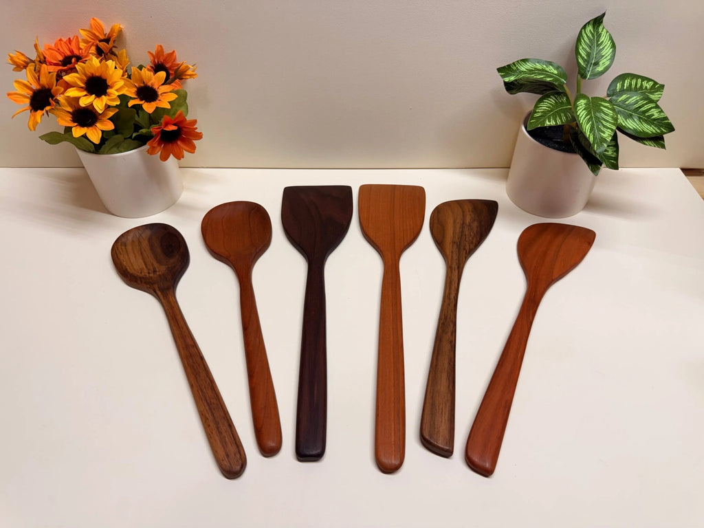 Handmade wooden kitchen utensils set with mixed spoon and spatula shapes